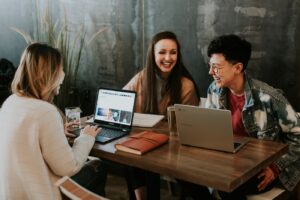 Creative team reviewing brand work on laptops