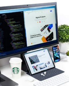 Landing page design shown on desktop, tablet and phone screens